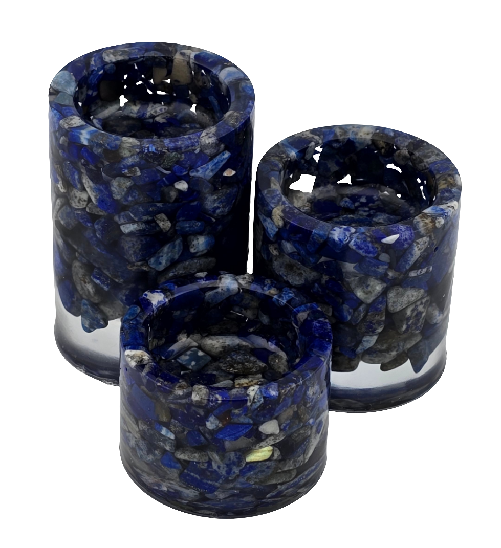 Set of three Lapis Lazuli cylindrical tea light candle holders on a white background. No candles.