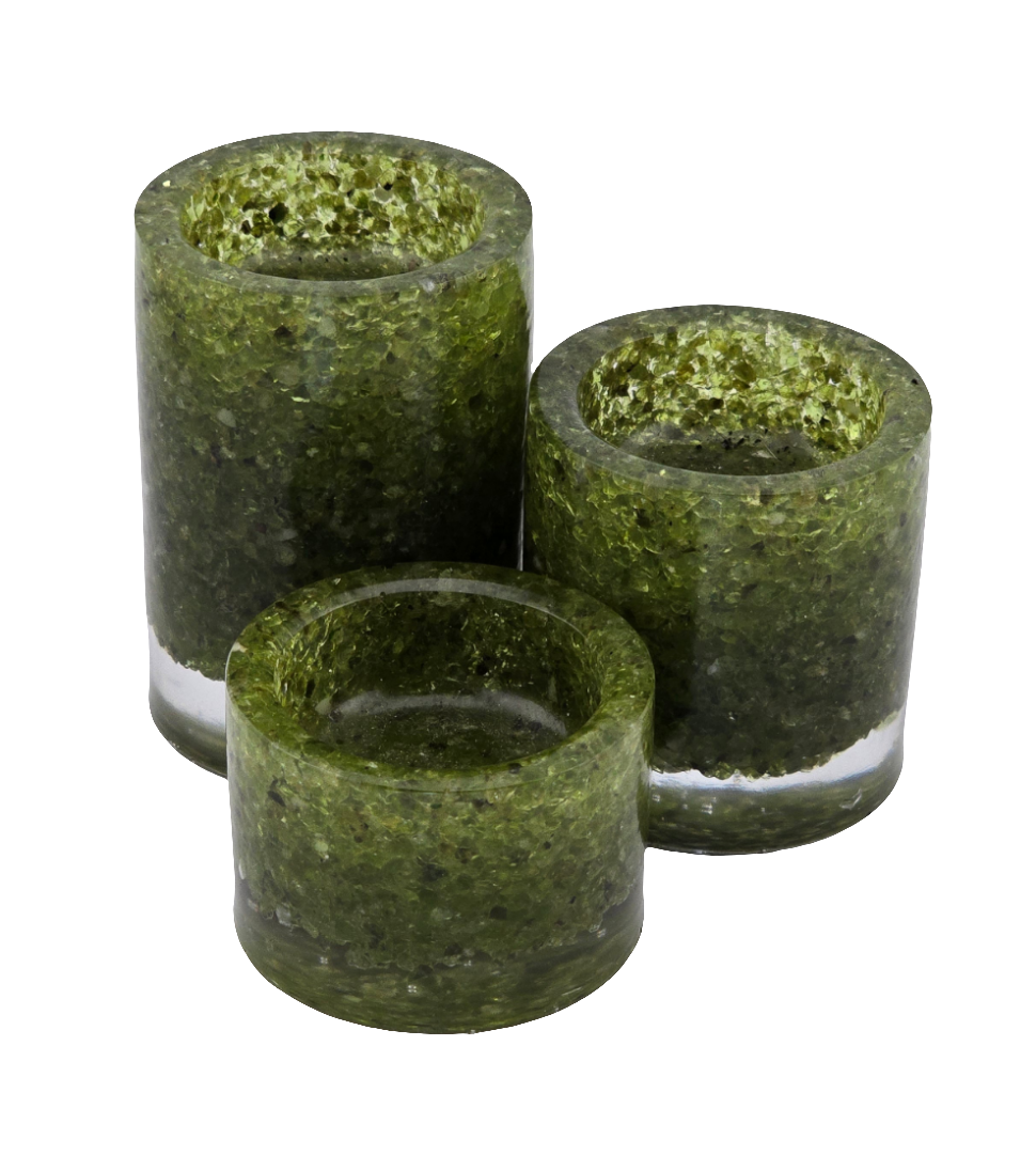 Three green peridot tea light candle holders on a white background
