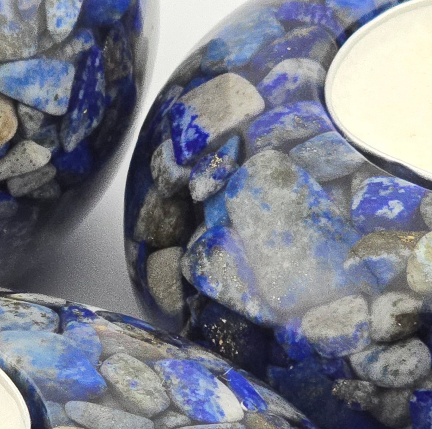Close-up of blue and gray Lapis Lazui tea light holders