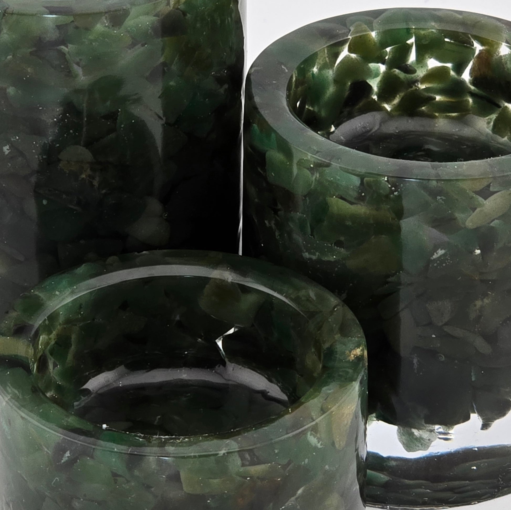 Three green Aventurine tea light candle holders close-up.