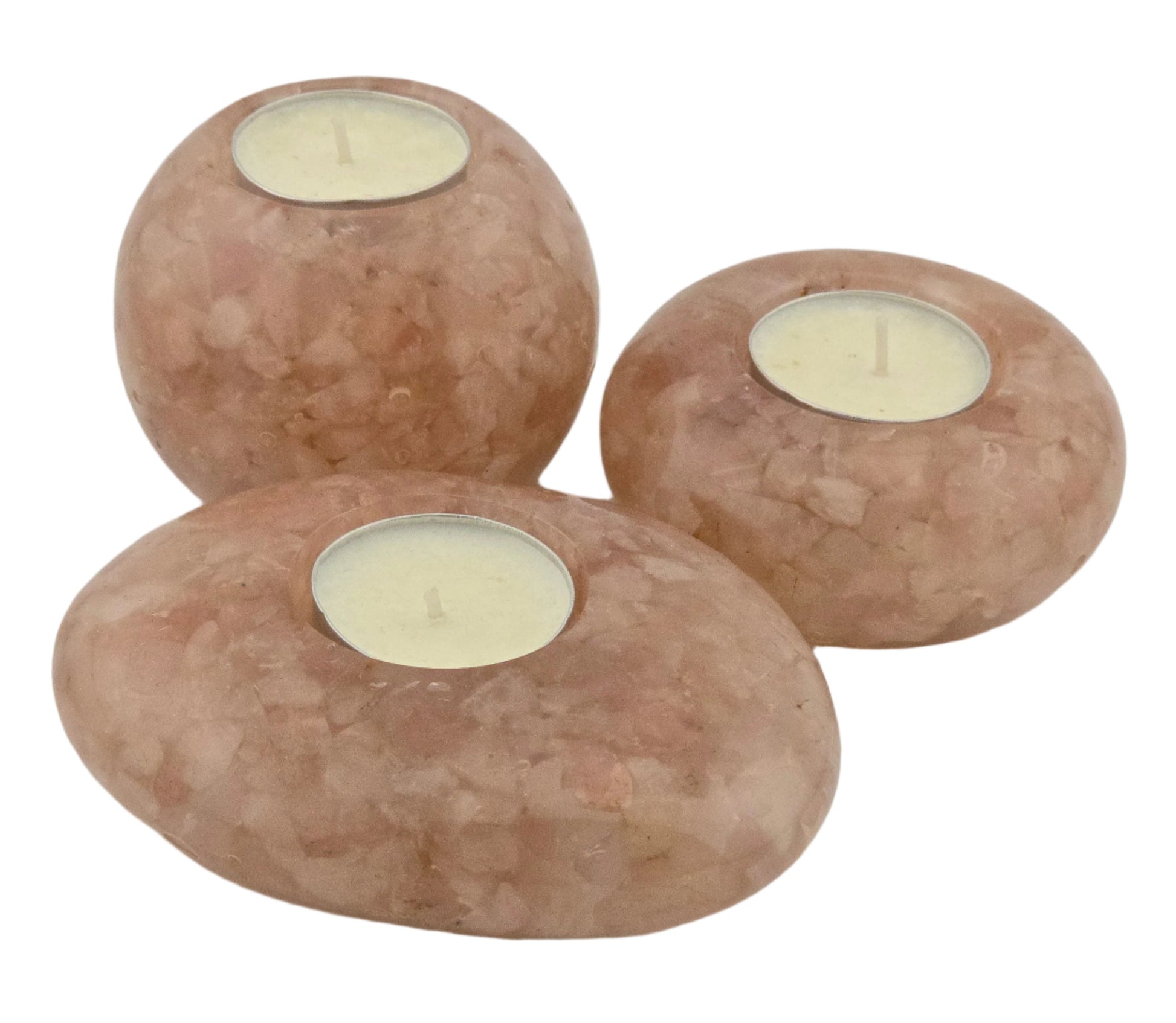 Three stone candle holders with candles inside on a white background
