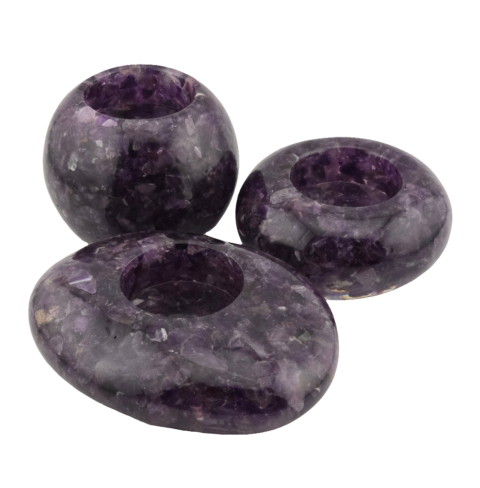 Three purple stone candle holders on a white background