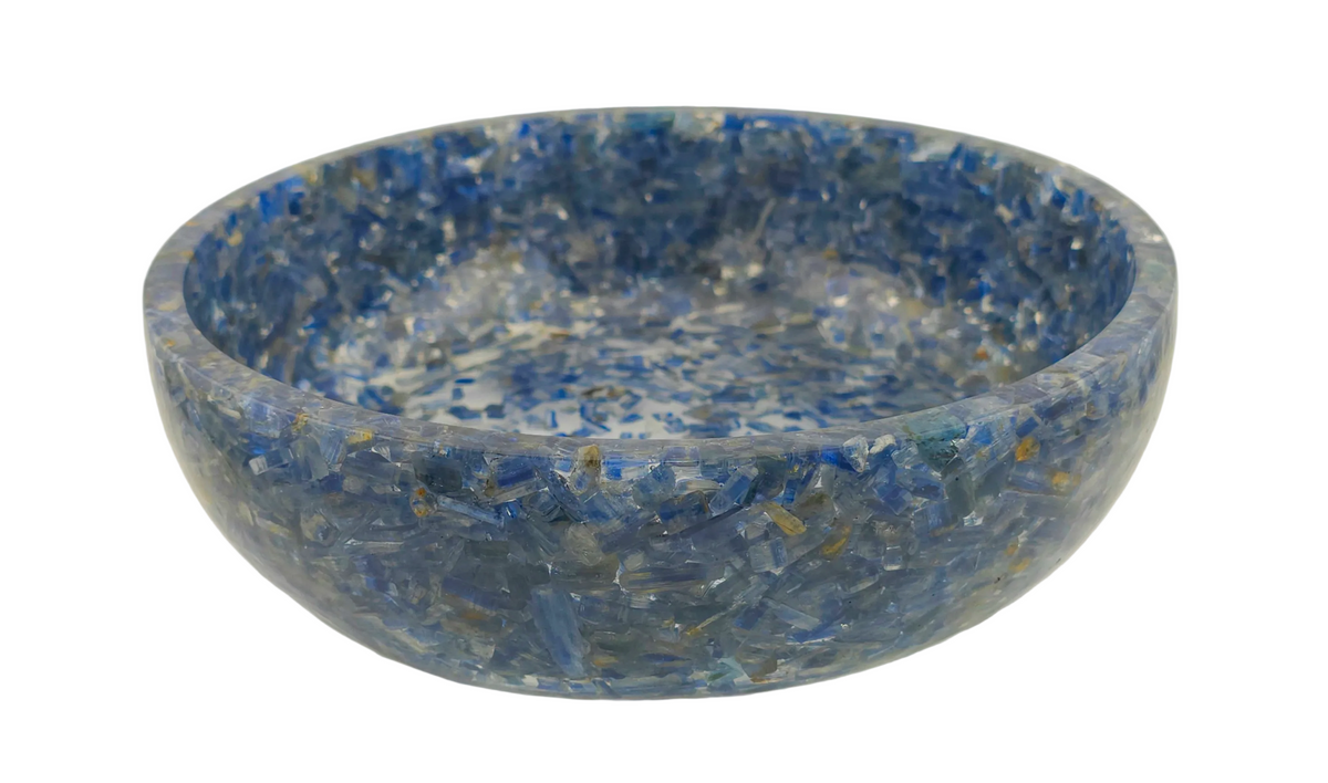 A round decorative bowl made from blue Kyanite fragments, featuring a textured, speckled pattern of various shades of blue, gray, and white, shown on a plain white background.