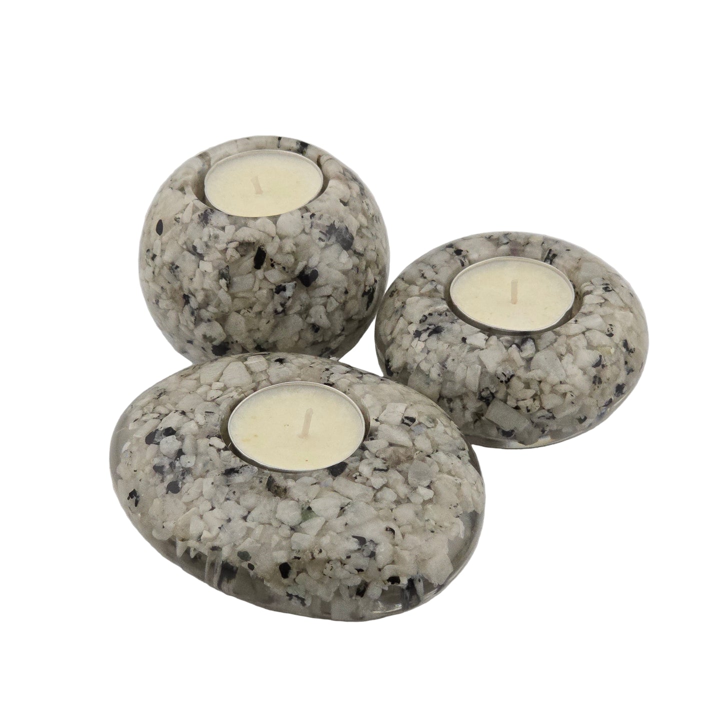 Three Rainbow Moonstone candle holders with candles on a white background