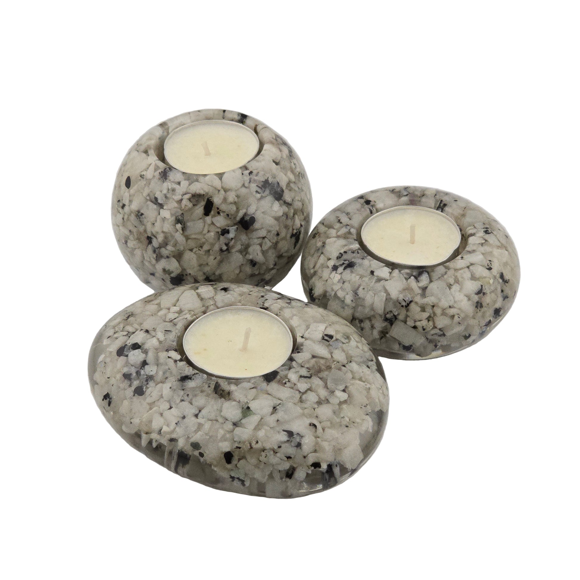 Three Rainbow Moonstone candle holders with candles on a white background
